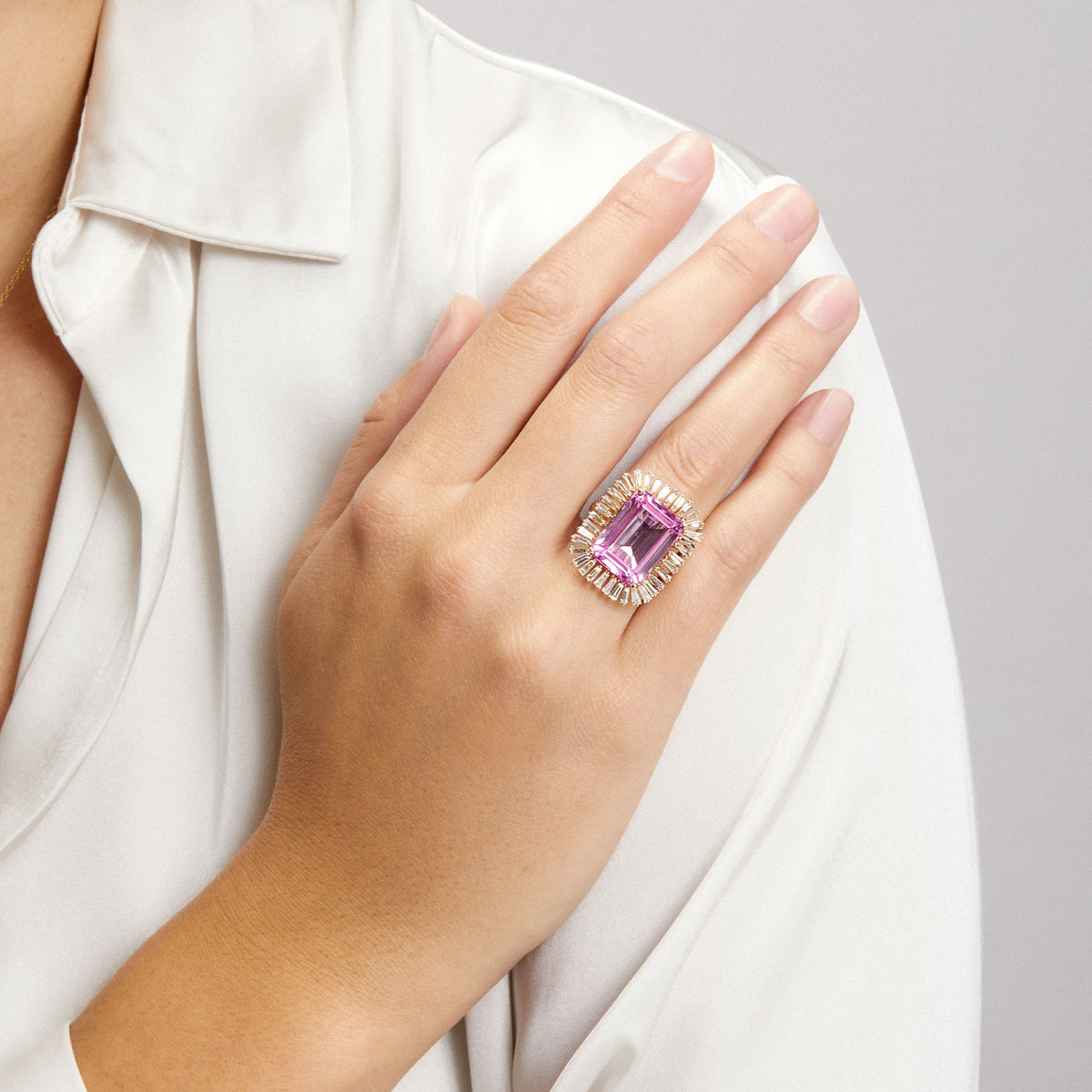 Model wearing 18KT Yellow Gold Pink Topaz Baguette Diamond Luxe Fauna Ring