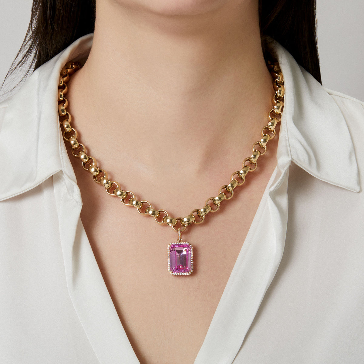 Model wearing 18KT Yellow Gold Diamond Pink Topaz Luxe Jolly Charm Pendant with Diamond Clip on Bail