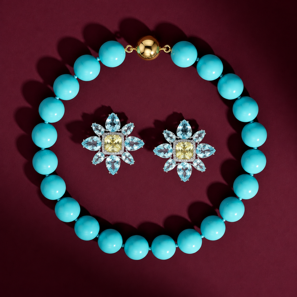 Turquoise beaded neckalce and amaryllis blue topaz flower earrings on burgundy background