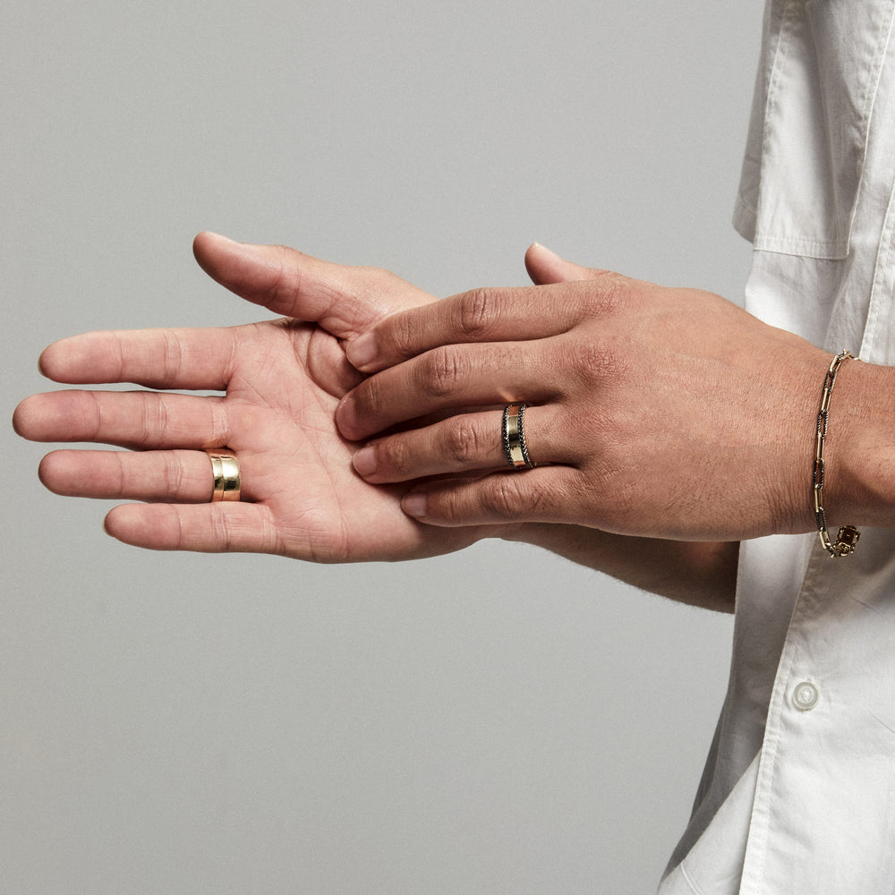 Model wearing 14KT Yellow Gold Black Diamond Jackson Band Ring