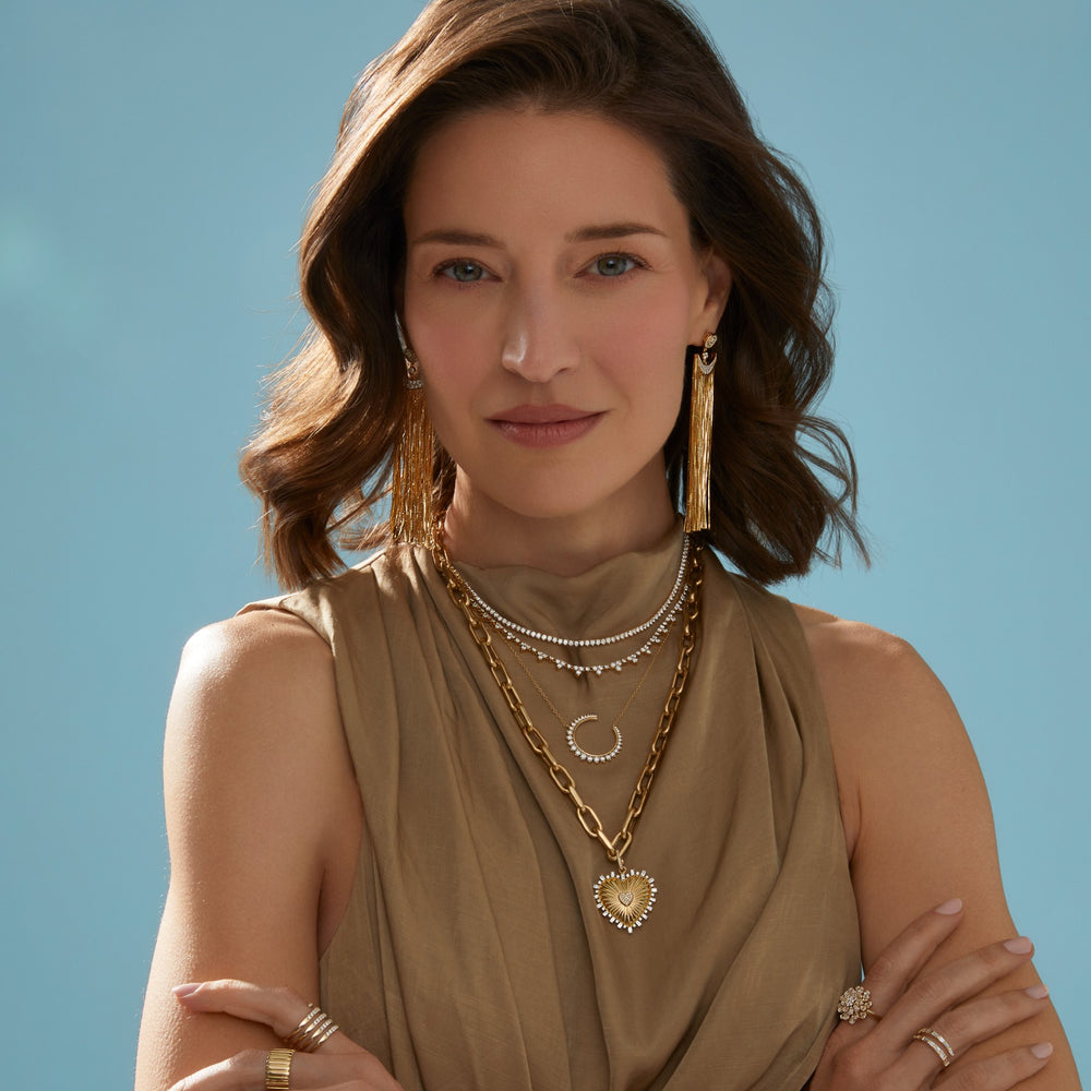 Model wearing 14KT Yellow Gold Baguette Diamond Heart of Gold Charm Pendant with Diamond Clip on Bail