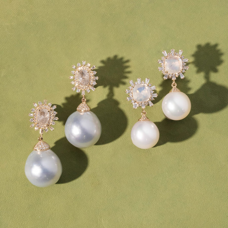 One of a kind pearl diamond earrings with moonstone and raw diamond on a green background