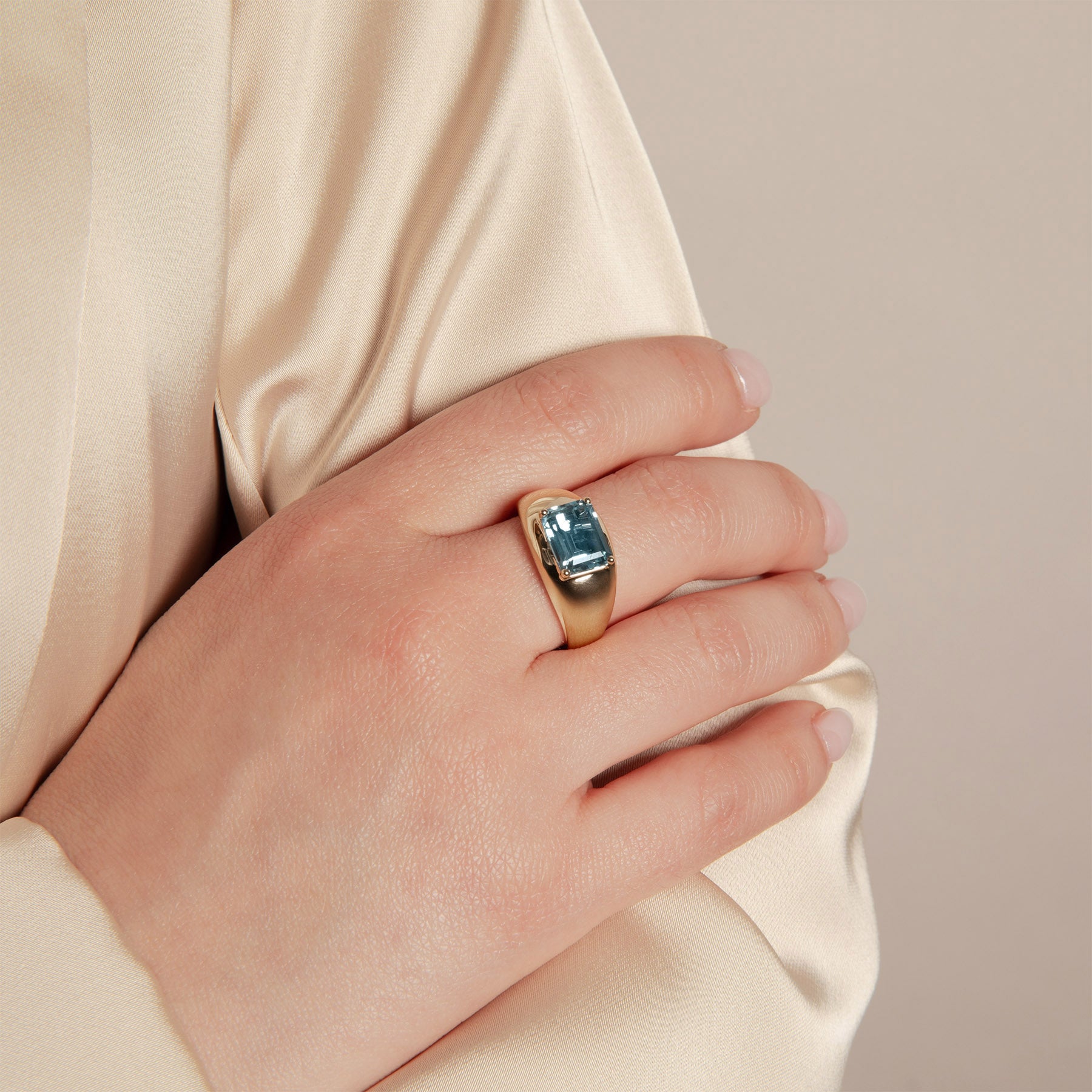 Model wearing 14KT Yellow Gold Blue Topaz Spritz Aperitif Ring