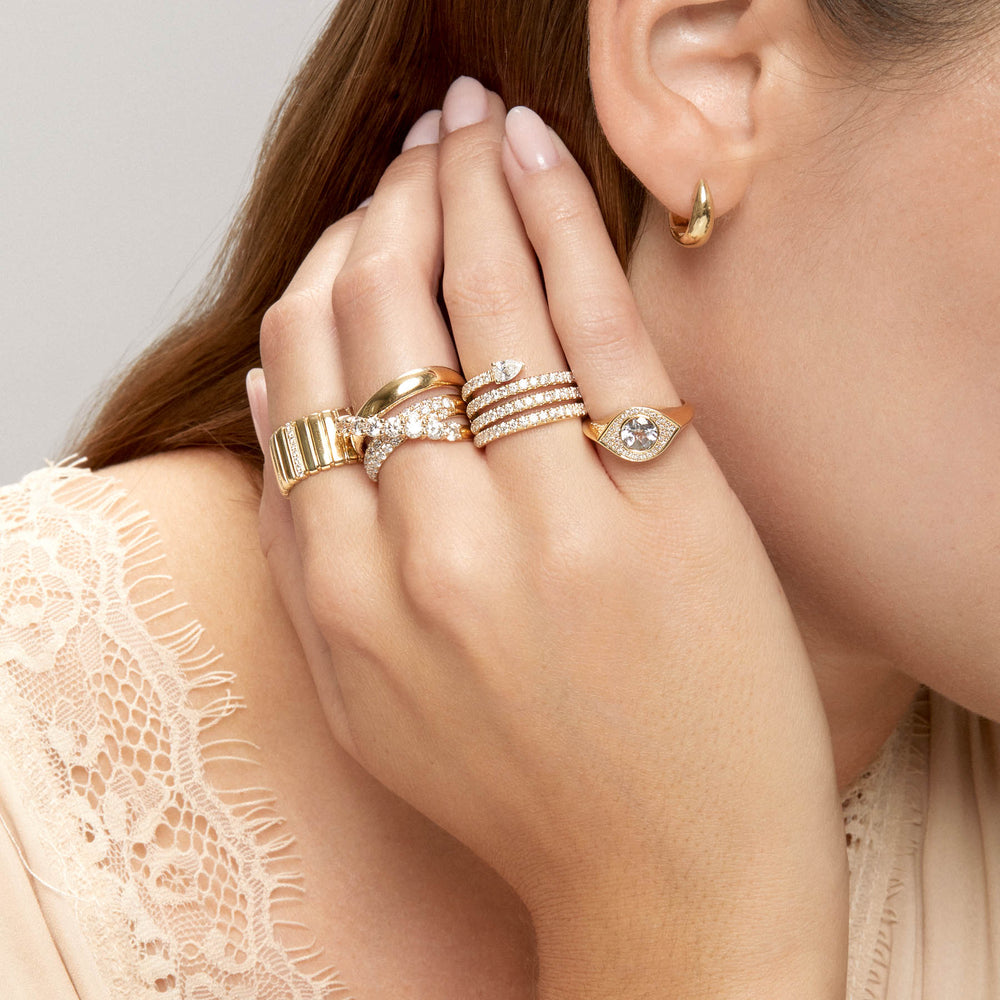 Model wearing 14KT Yellow Gold Gwyn Huggie Earrings