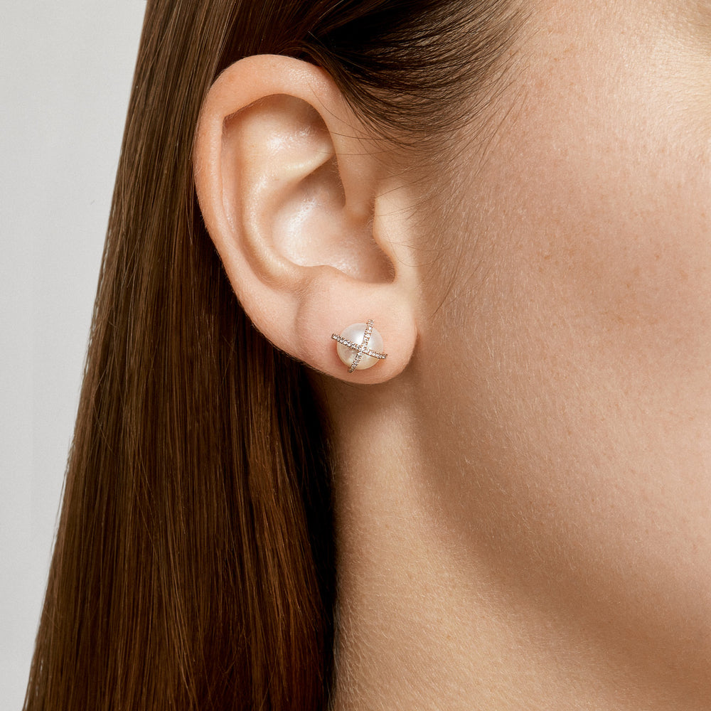 Model wearing 14KT Yellow Gold Diamond X Pearl Stud Earrings