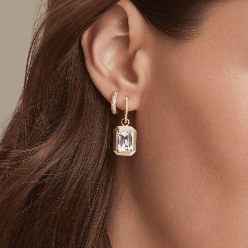 Model wearing 18KT Rose Gold Diamond Brooklyn Huggie Earrings