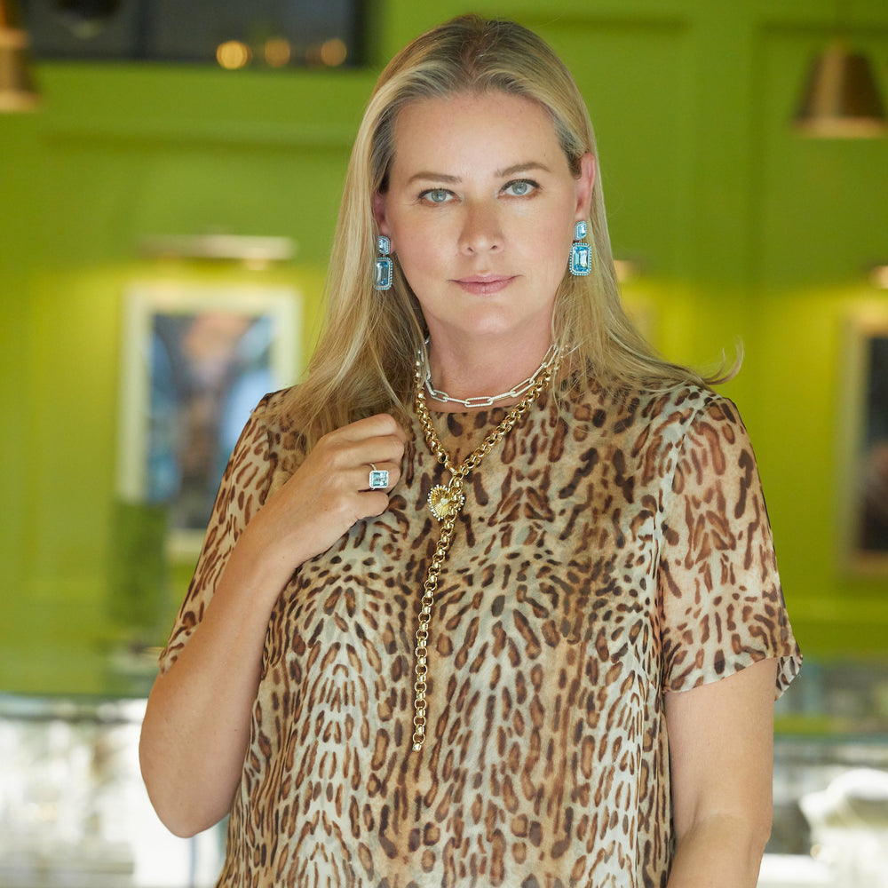 Model wearing 14KT Yellow Gold Baguette Diamond Heart of Gold Charm Pendant with Diamond Clip on Bail