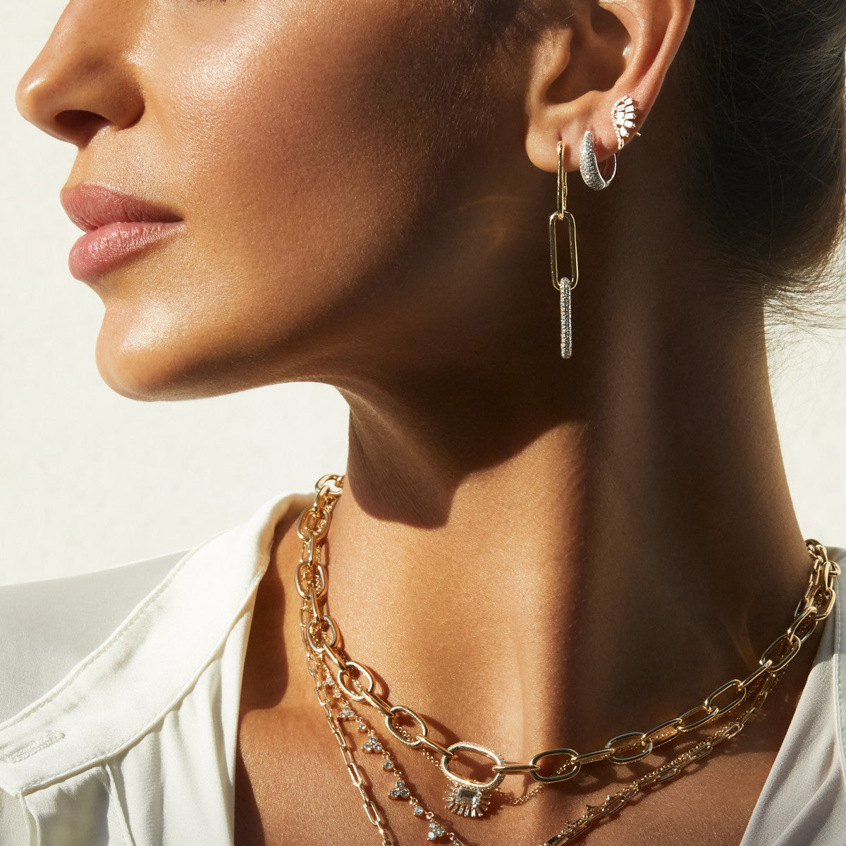 Model wearing 14KT Yellow Gold Diamond Gwyneth Huggie Earrings
