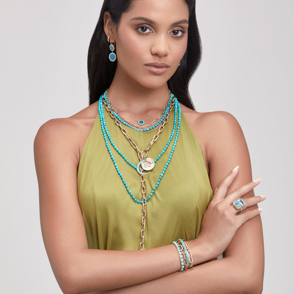 Model wearing 14KT Yellow Gold Turquoise Diamond Lunar Charm Pendant with Diamond Clip On Bail