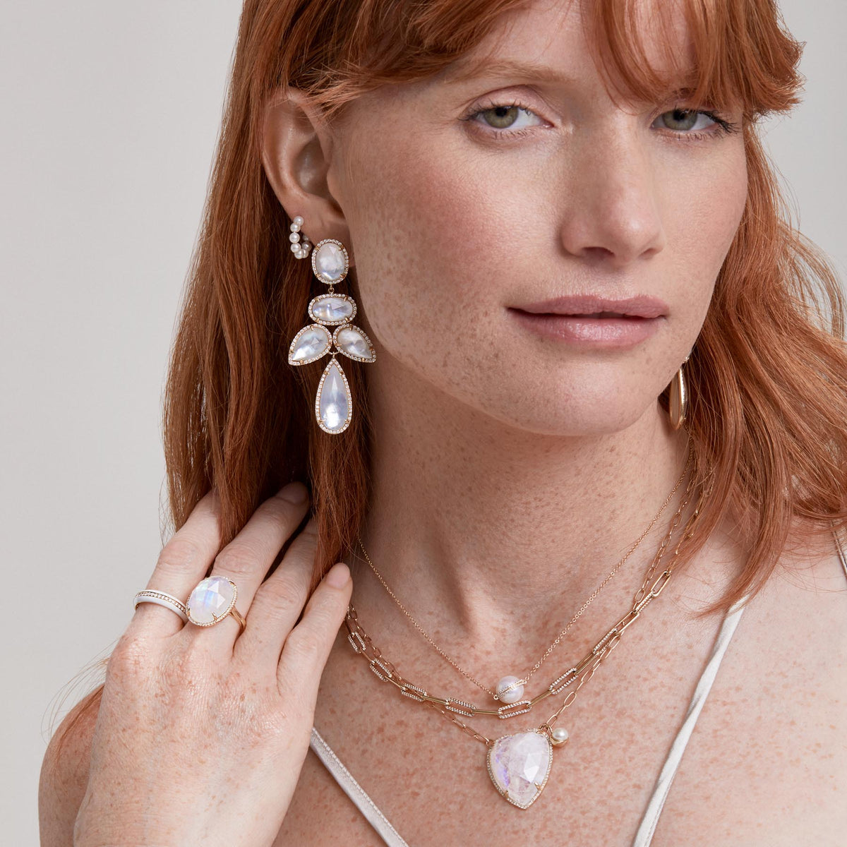 Model wearing 14KT Yellow Gold Mother of Pearl Doublet Diamond Bellissima Chandelier Earrings