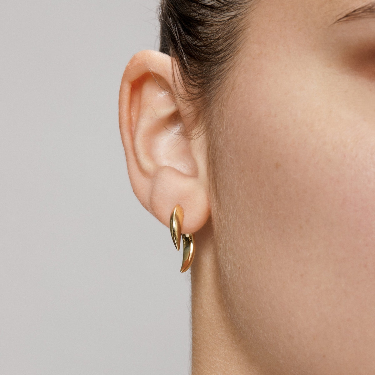 Model wearing 14KT Yellow Gold Sabre Earrings